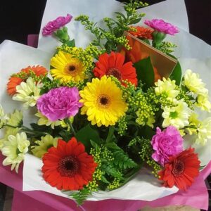 Margaret Raymond Florist Happy Flowers with bright pink, red, orange and yellow